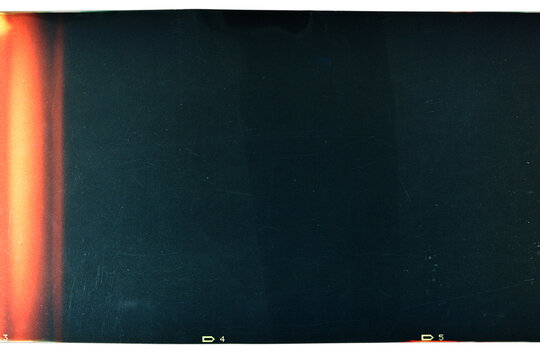 Grungy color 120mm negative film isolated on white background. Medium format film material on white background, retro photo placeholder.