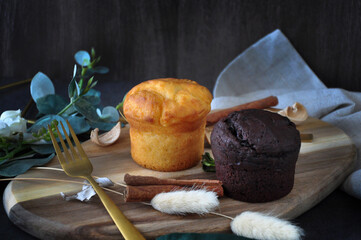 Fresh Butter and Chocolate Muffins on Wooden Board