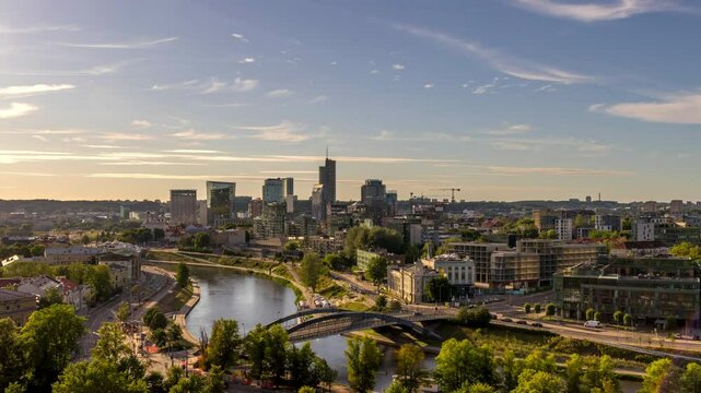 4k timelapse of the skyline of Vilnius behind the river at a sunny day in summer.