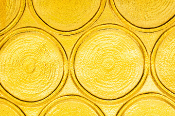 Close-up of vibrant yellow textured circular patterns, ideal for backgrounds or design concepts