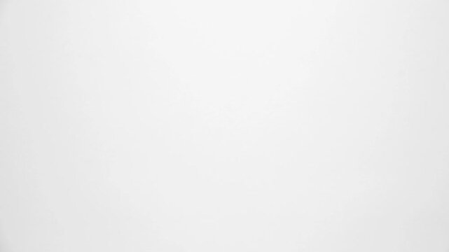 Paper sheets tearing from the center opening the screen transition. Stop motion animation