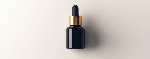Obraz premium Black Glass Dropper Bottle with Gold Cap on White Background