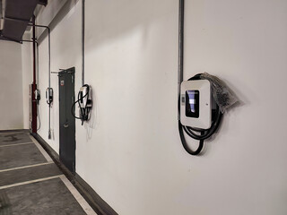 Modern Electric Vehicle Charging Stations Installed in Urban Parking Garage