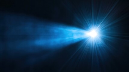 A bright blue spotlight shines in a dark room, creating a dramatic and powerful effect.