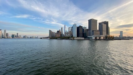 Naklejka premium New York City - SEP 13 2023: Downtown New York skyline panorama viewed from a boat sailing the Upper Bay