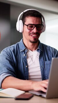 Male Student Studying With Computer Doing Research