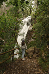 Young woman on Ribasieira Waterfall, Porto do Son