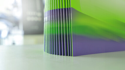 Stitched printing brochures in the bookbindery or print shop. Print sorted with spine. Lettershop or bookbinder.