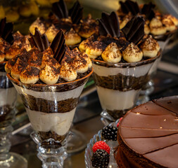 Delicious layered chocolate desserts in tall glasses.