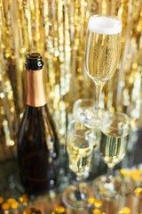 a bottle of champagne and glasses for champagne for christmas, new year, party, wedding celebration...