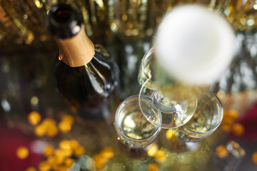 a bottle of champagne and glasses for champagne for christmas, new year, party, wedding celebration...