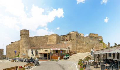 Naklejka premium Giglio, Italy - 29.5.2024: Old town of Giglio Castello at Isola del Giglio, island of the tuscan archipelago, beautiful ancient rustico buildings and historical architecture, Grosseto Tuscany Italy