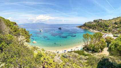 View to Cannelle beach, Spiaggia delle Cannelle, near Giglio Porto with view to mediterranean sea and beautiful blue bay at Isola del Giglio, island of the tuscan archipelago, Grosseto Tuscany Italy