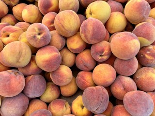 peaches on a market. close up of peaches seen from above - fruit background