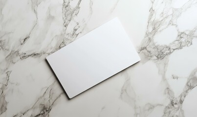 Blank white card on marble background.
