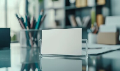Blank sign holder on glass desk.