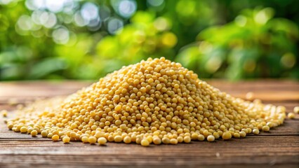 A cluster of organic fox millet grains rests on a rustic wooden surface, enveloped by a dreamy blur of atmosphere.
