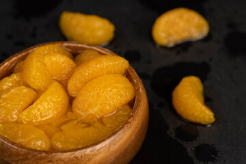 peeled orange tangerines marinated in sugar syrup
