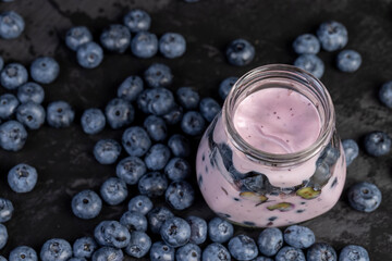 fresh cold yogurt with the taste and berries of ripe blueberries