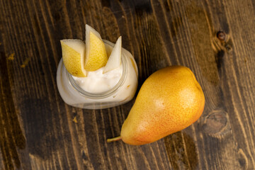 pear yogurt with pieces of fruit on the table