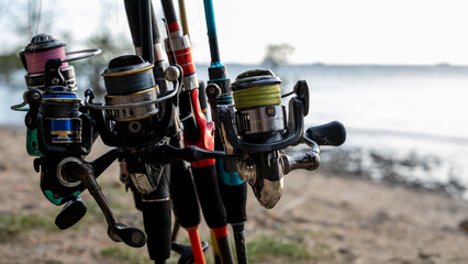 Close-up of Fishing Reels and Rods by the Water