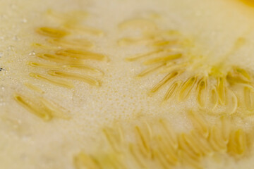 cut yellow ripe pumpkins on the table in close-up