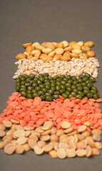 Assorted different types of beans and cereals grains. Set of indispensable sources of protein for a healthy lifestyle. Everyday use at Indian households.