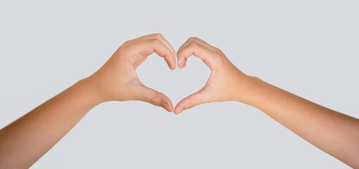 Man and woman hands making a heart shape. Female hands making sign heart by fingers, isolated on...