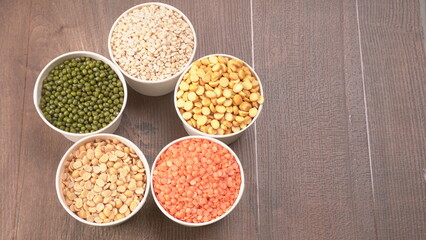 Assorted different types of beans and cereals grains. Set of indispensable sources of protein for a healthy lifestyle. Everyday use at Indian households.