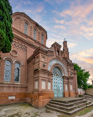 Stunning view of the entrance of Alexander Nevsky Church showcases its intricate red bricks...