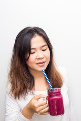 Beautiful healthy women drinking mix berry smoothie healthy food