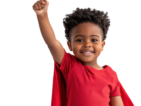 Boy wearing red superhero cape, raising arm, smiling joyfully, isolated on white background.  PNG transparent.