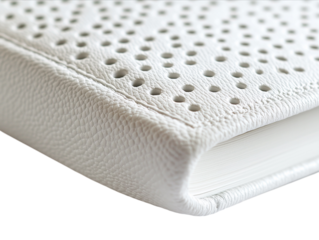Open Braille book with raised dots, close-up detail, isolated on a white background.  PNG transparent.