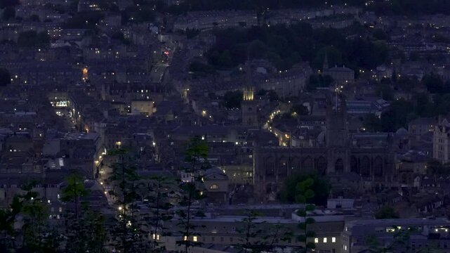 City lights twinkling over bath abbey at twilight