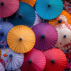 Colorful traditional Japanese umbrellas arranged in a close-up pattern.