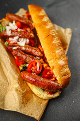 hot dog sausages, bun, greens, sauce fast food delicious food dish Fresh delicious gourmet food background on the table rustic food top view copy space