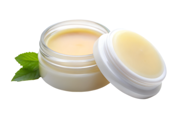 Natural lip balm in glass jar with green leaves isolated on transparent background