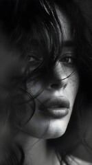 Fototapeta premium Intense Portrait Dramatic Shadows Freckles Radiant Skin Soft Light Expression Hair Focus. AI Generated