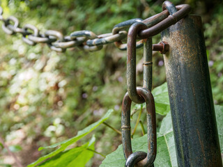 A close-up of a metal chain with a detailed texture that emphasizes strength and durability, ideal for industrial themes