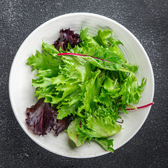 salad green leaves mix salad fresh meal food snack on the table copy space food background rustic...