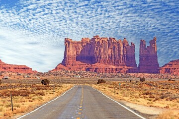 Panoramic picture along an empty road through Monument Valley