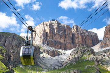 Sass Pordoi cable car moving up to the mountain top, Dolomites, Italy