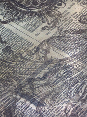 vintage newsprint with patterned stamps over, beige and grey