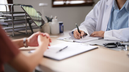 Fototapeta premium Asian psychologist women giving help and support to counseling about medicine and mental health therapy to patient in clinic while female patient stress and anxiety with psychological health problem