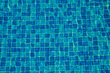 blue water in swimming pool background