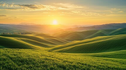 Fototapeta premium A beautiful, sunlit landscape with rolling hills and a clear blue sky