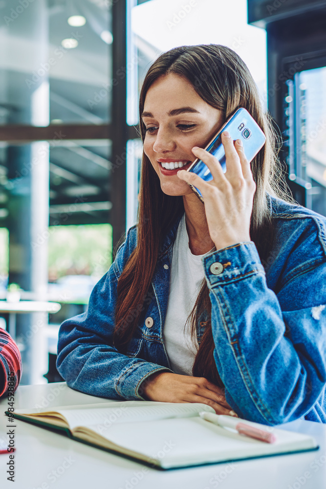 Aufkleber happy smiling woman calling to friend for discussing time of meeting in cafeteria while hipster guy 