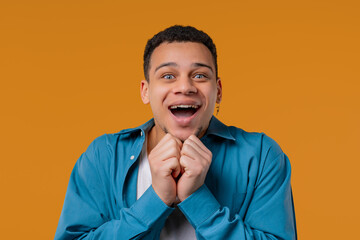 Shocked african american man glad, screaming WOW. Impressed guy, unbelievable