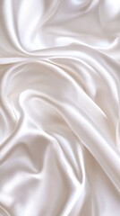 Obraz premium A close-up view of smooth white satin fabric, showcasing its elegant folds and luxurious sheen, perfect for textile designs.