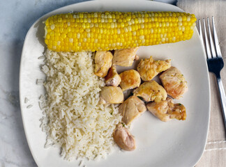chicken bites  with rice and corn